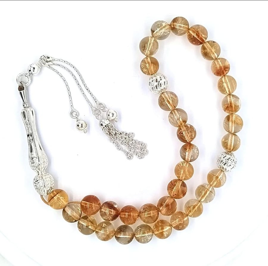 A rosary of natural citrine stones 33 with silver