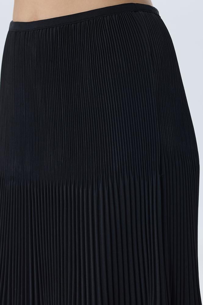 Long black pleated skirt in a classic style