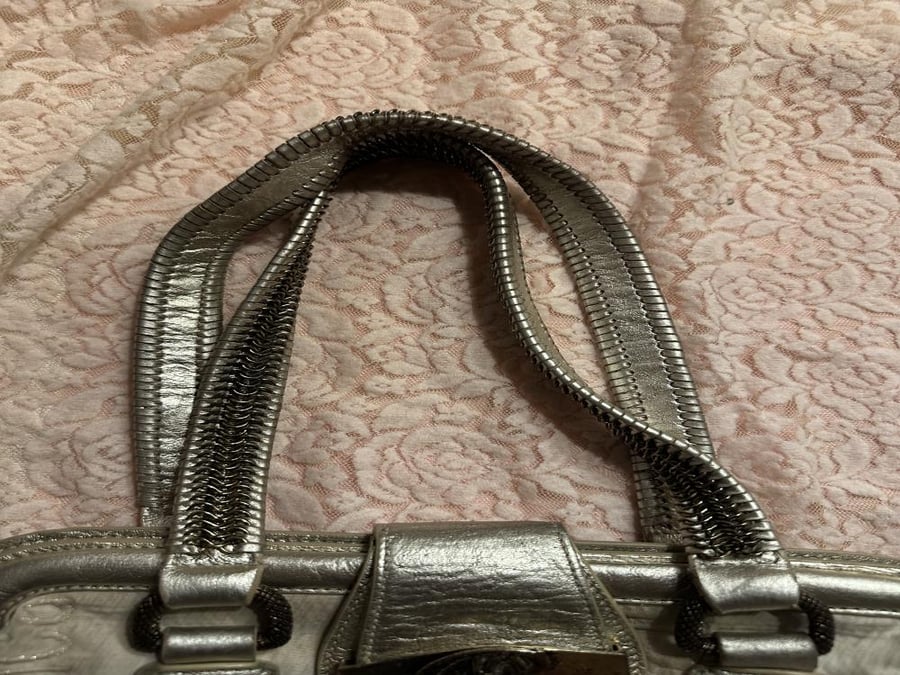 Just Cavalli handbag featuring a silver monogrammed fabric