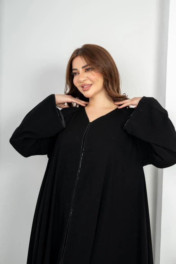 Elegant flared abaya with a decorative belt at the front and on the sleeve