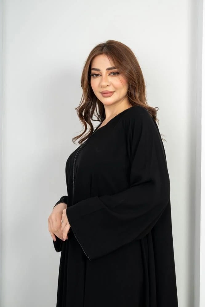 Elegant flared abaya with a decorative belt at the front and on the sleeve