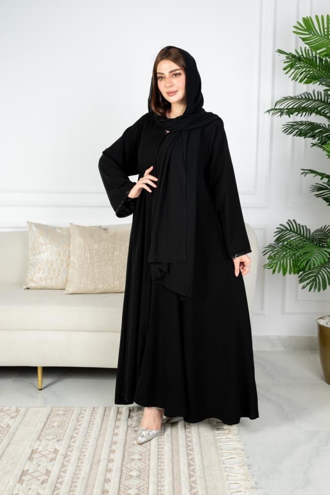 A wide abaya with embroidery and beadwork on the sleeve