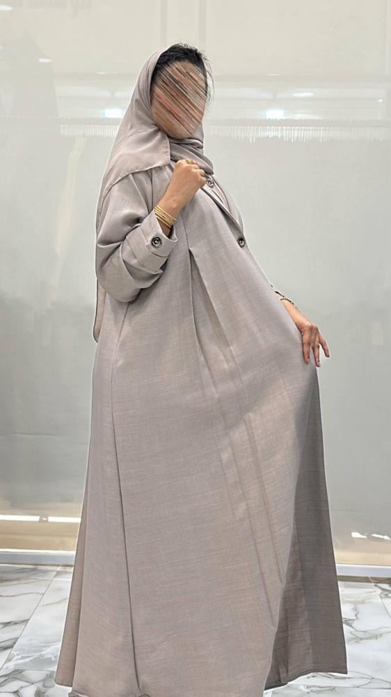 Al-Jazi abaya with a flared cut made of linen fabric, set with a dress