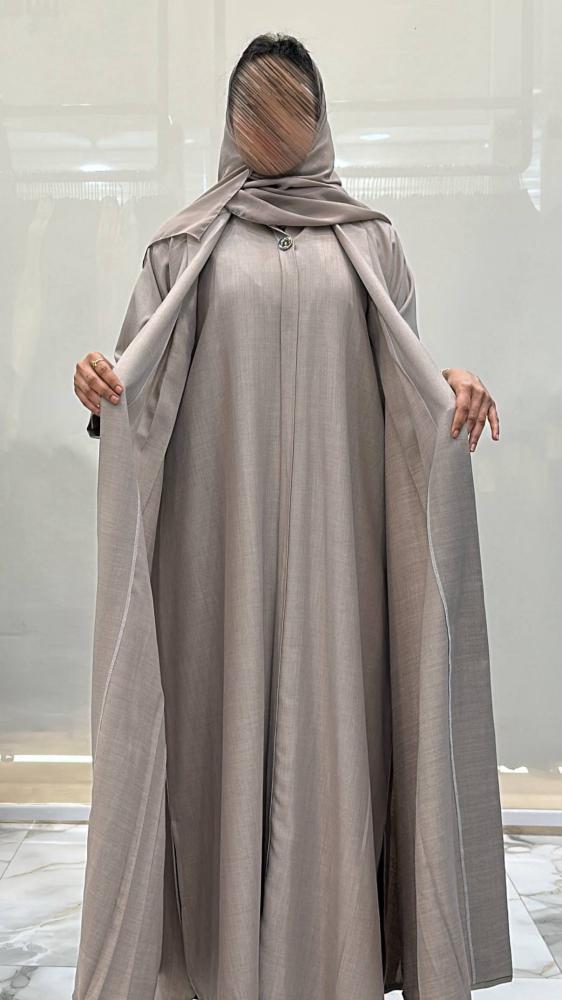 Al-Jazi abaya with a flared cut made of linen fabric, set with a dress