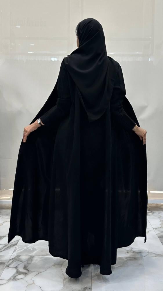 Hanane abaya with flared design made of dark Indonesian fabric with crystal