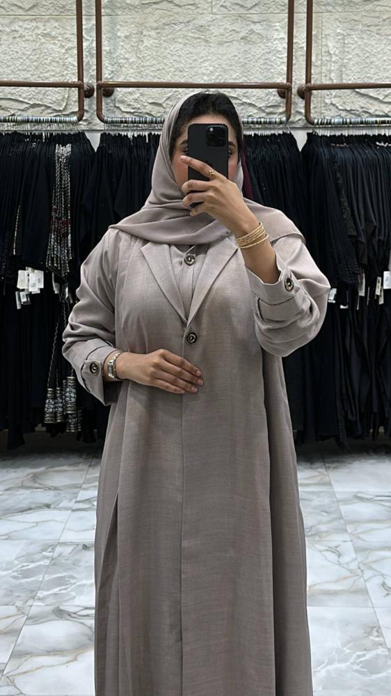 Al-Jazi abaya with a flared cut made of linen fabric, set with a dress