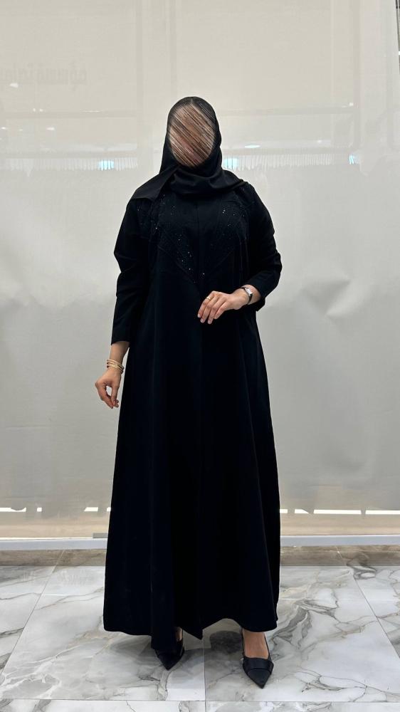 Hanane abaya with flared design made of dark Indonesian fabric with crystal