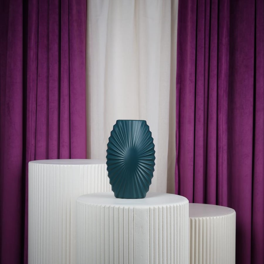 Green plastic flower vase