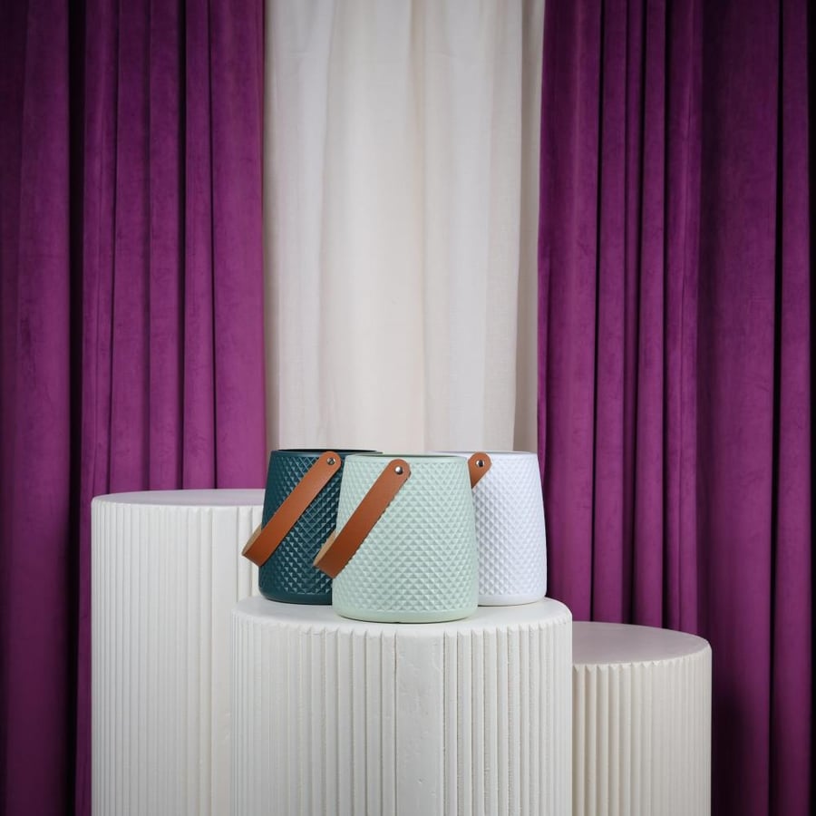 white plastic flower vase