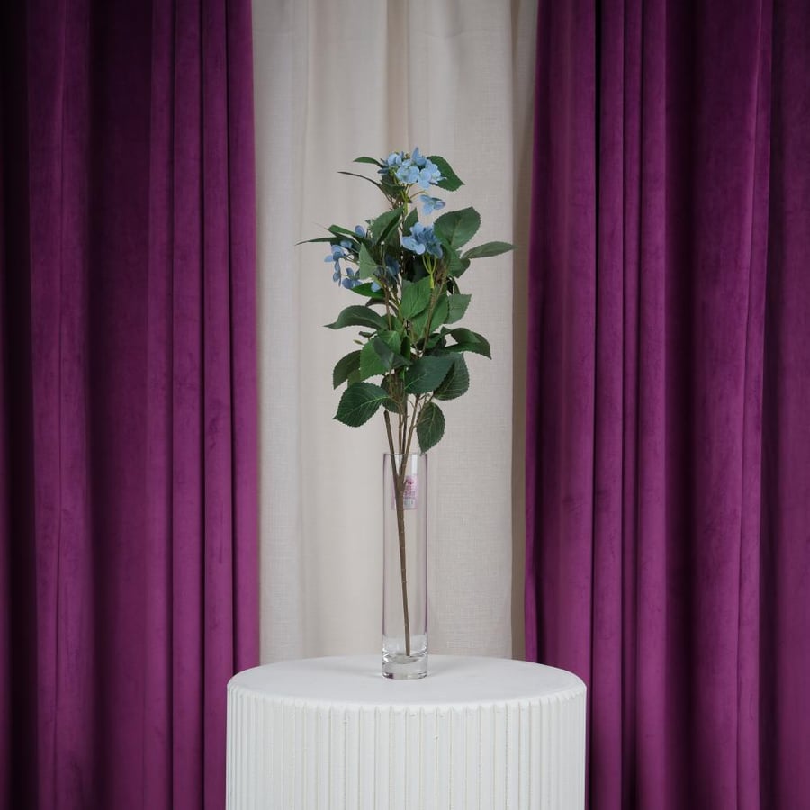 Artificial green rose on sky blue