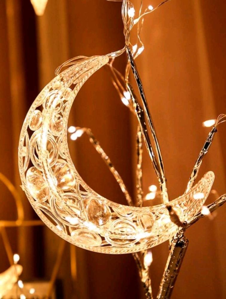 Curtain lighting with star and crescent shapes with yellow lighting