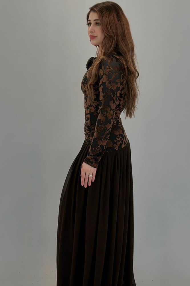 A dress that combines various fabrics and design styles
