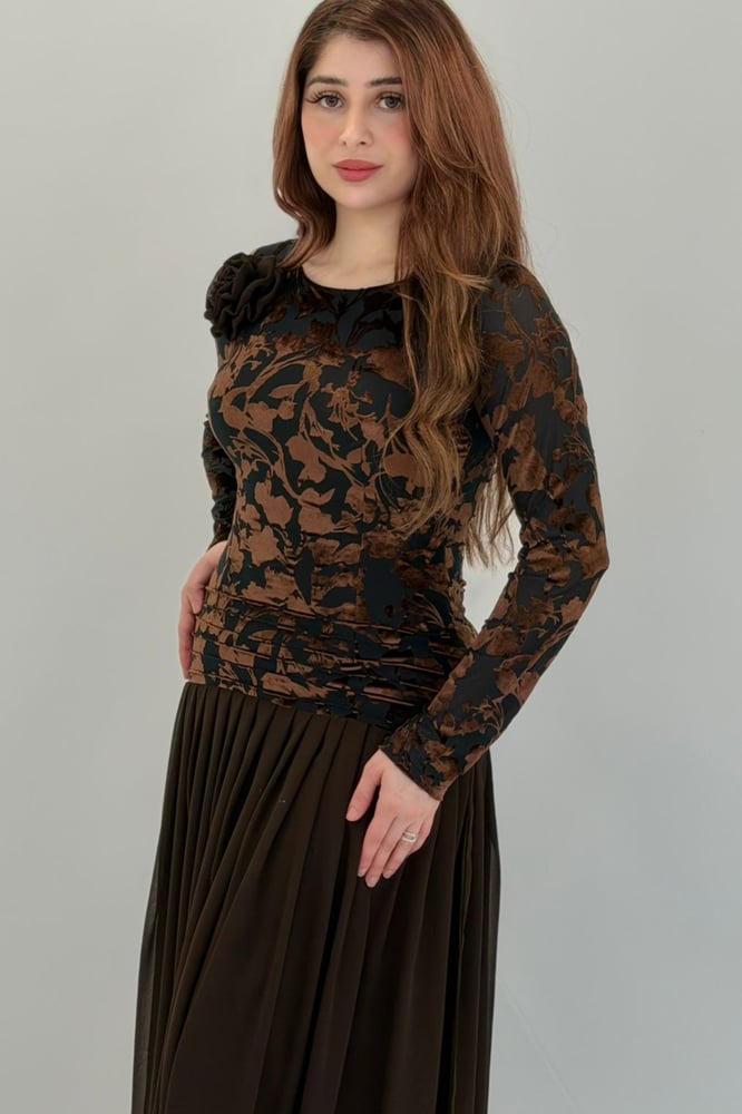 A dress that combines various fabrics and design styles