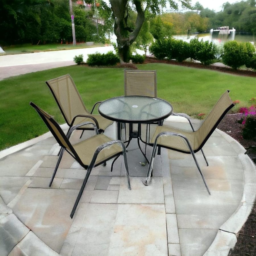 Outdoor brown dining table with 4 seats and glass table