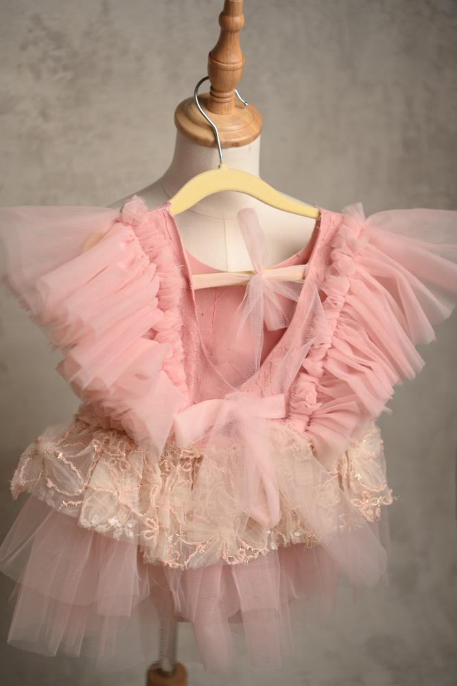 A pink-colored dress with a collar