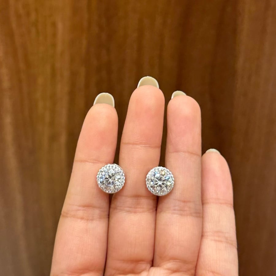 Silver hoop earrings decorated with Swiss zircon