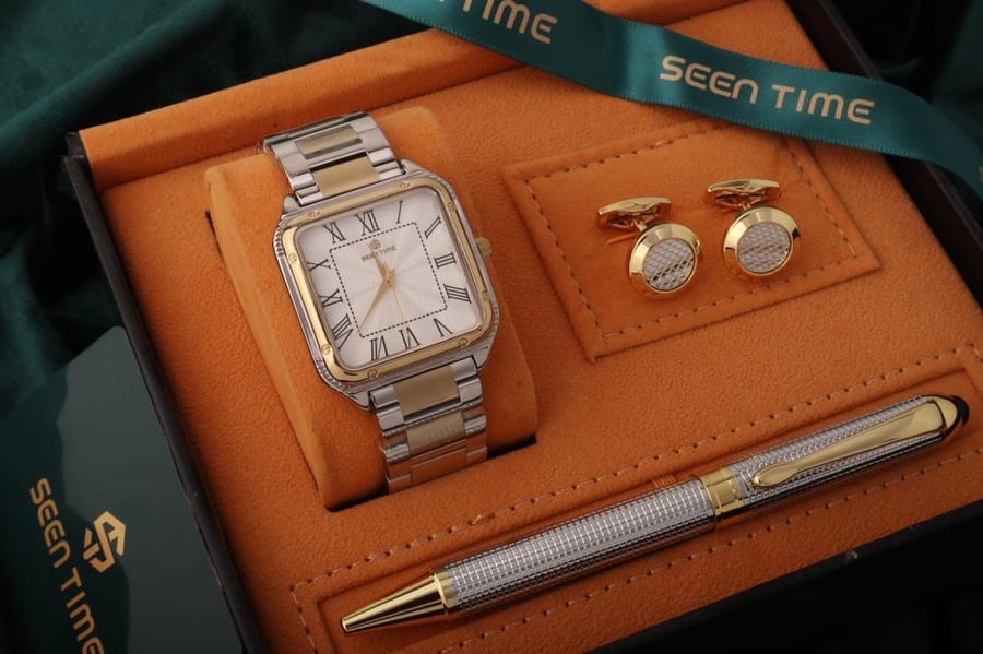 A watch with a pen and men's cufflinks