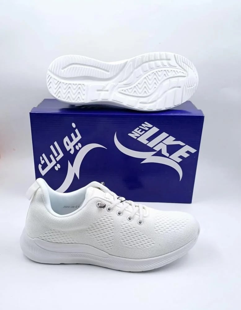 White and black sports shoe New Balance
