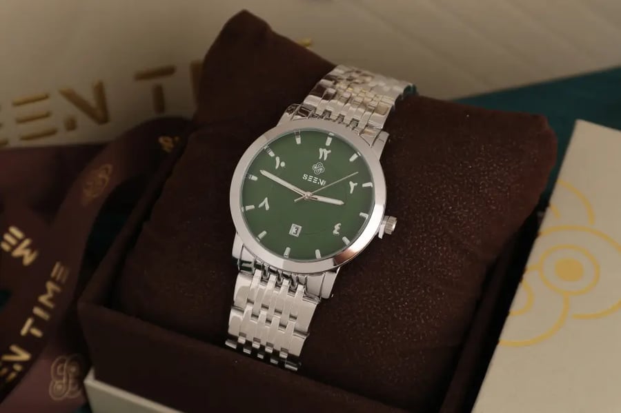 ساعة رجالية SEEN TIME دائرية بأرقام عربية ومؤشر تاريخ وسوار ستانلس ستيل
