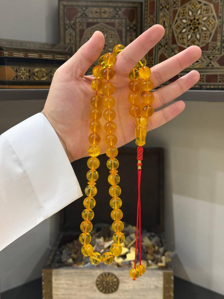 مسباح كهرم طبيعي كلنقرادي كروي - حجر السلطان ولك من الاسم نصيب