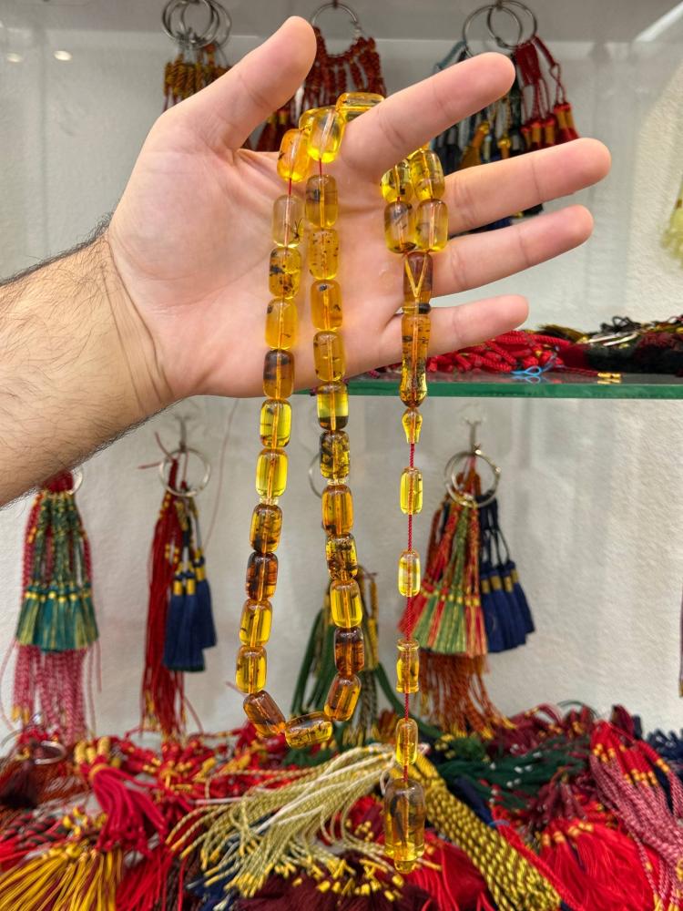 سبح كهرب طبيعي شفاف حشري - حجر السلطان ولك من الاسم نصيب