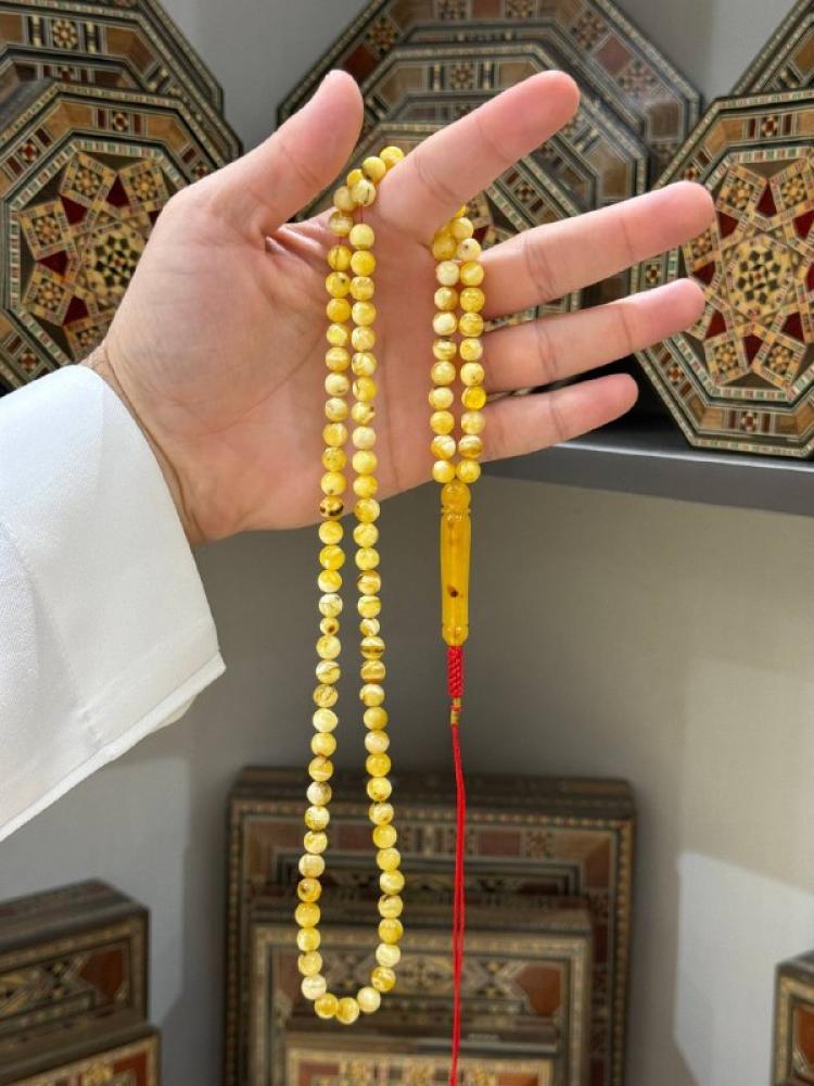 مسباح كهرم طبيعي شوائبي كروي - حجر السلطان ولك من الاسم نصيب