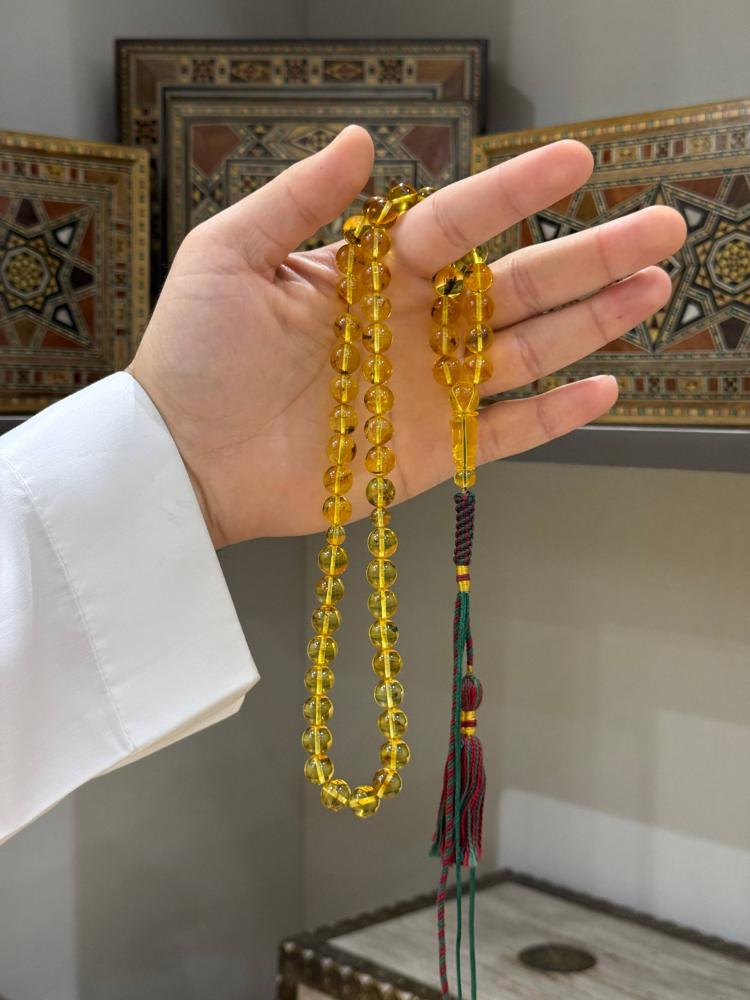 مسباح كهرمان طبيعي حشري كروي - حجر السلطان ولك من الاسم نصيب