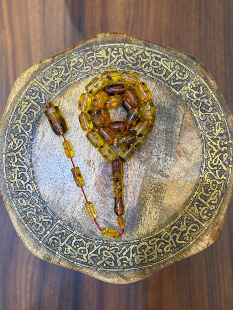 مسباح كهرم طبيعي شفاف حشري - حجر السلطان ولك من الاسم نصيب
