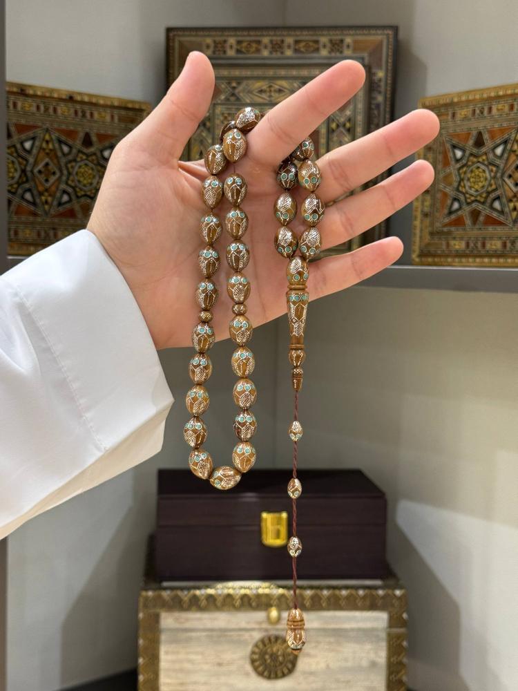 مسابيح خشب كوك مطعم فضة بيض حمام - حجر السلطان ولك من الاسم نصيب