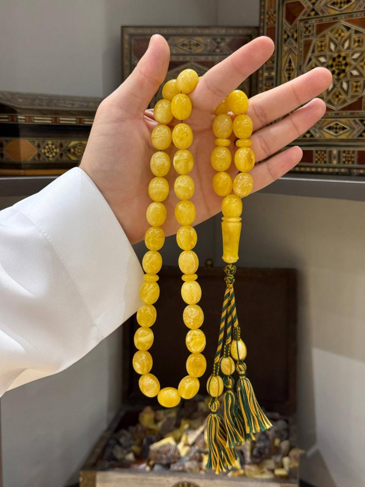 سبحة كهرمان طبيعي بيض حمام - حجر السلطان ولك من الاسم نصيب