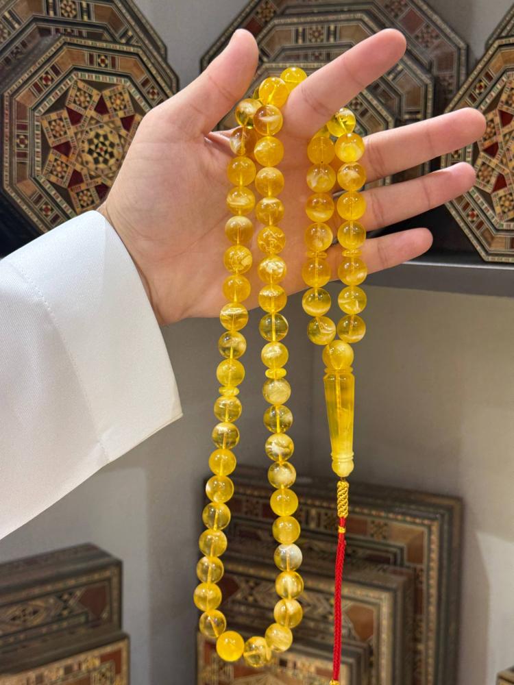 مسباح كهرمان طبيعي بلطيقي كروي - حجر السلطان ولك من الاسم نصيب