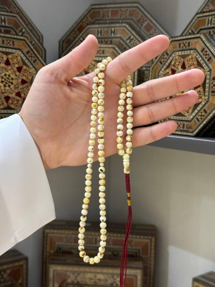 مسابيح كهرمان طبيعي شوائب ناعم كروي - حجر السلطان ولك من الاسم نصيب