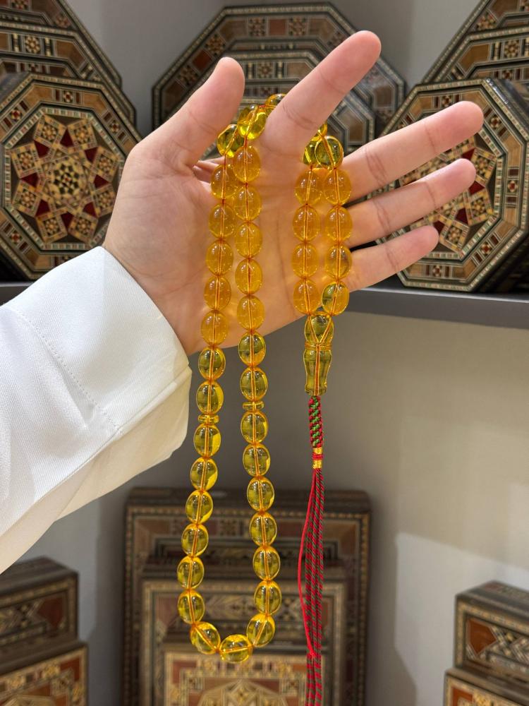 مسبحة كهرمان طبيعي شفاف بيض حمام - حجر السلطان ولك من الاسم نصيب