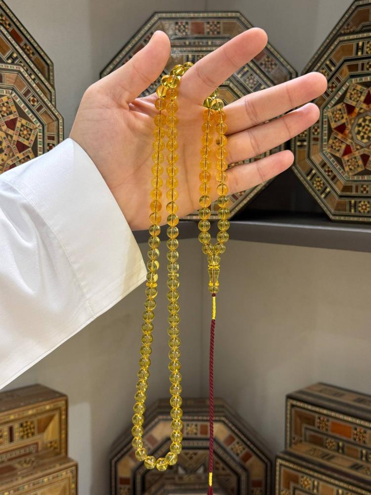 مسباح كهرمان طبيعي شفاف كروي - حجر السلطان ولك من الاسم نصيب