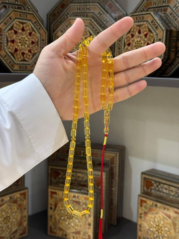 مسبحة كهرمان طبيعي شفاف برميلي - حجر السلطان ولك من الاسم نصيب