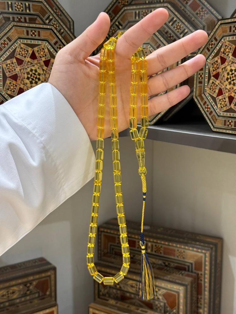 مسباح كهرمان طبيعي شفاف برميلي - حجر السلطان ولك من الاسم نصيب