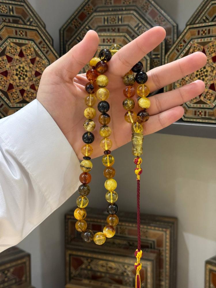 سبح كهرب طبيعي ماكنتوش كروي - حجر السلطان ولك من الاسم نصيب