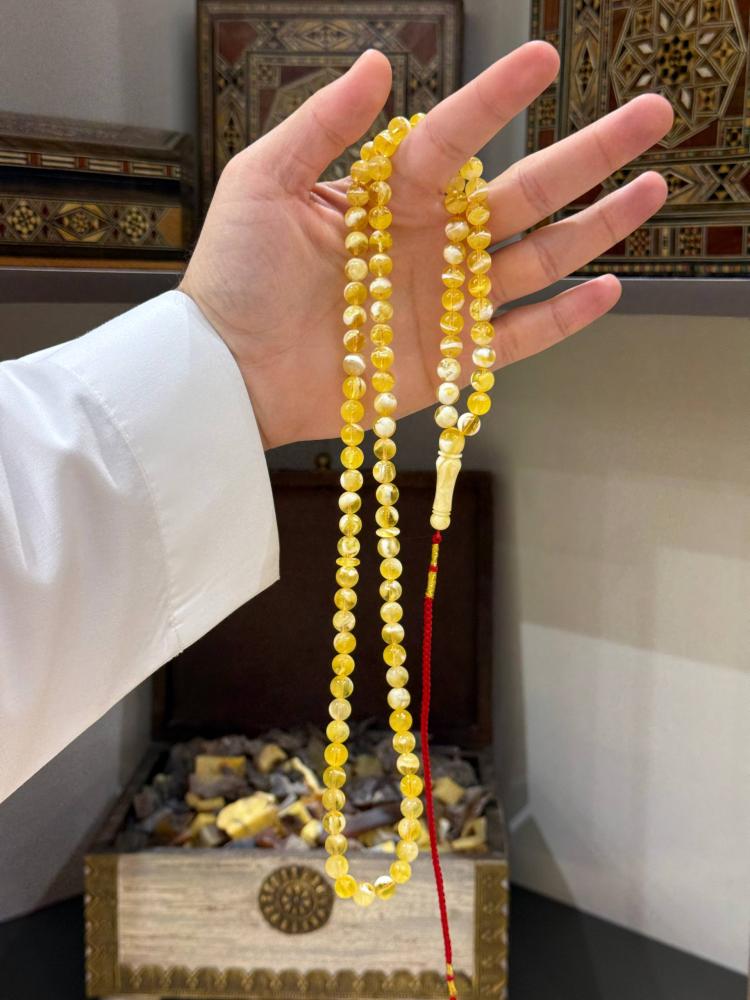 مسابيح كهرب طبيعي ملطخ كروي - حجر السلطان ولك من الاسم نصيب