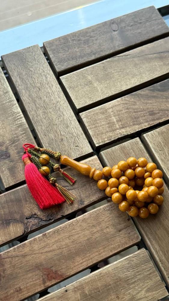 A prayer bead with a clasp