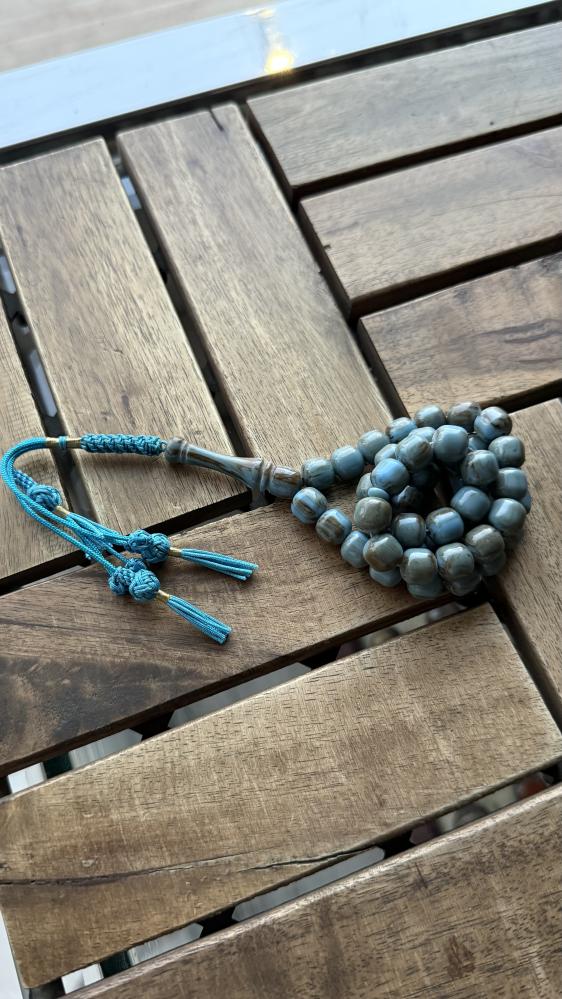 A prayer bead with a clasp