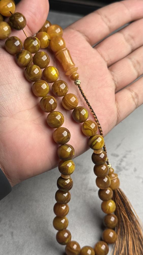 A rosary made of date syrup and rosary beads