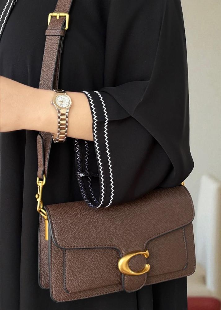 شنطه كوتش بني محروق لوقو ذهبي