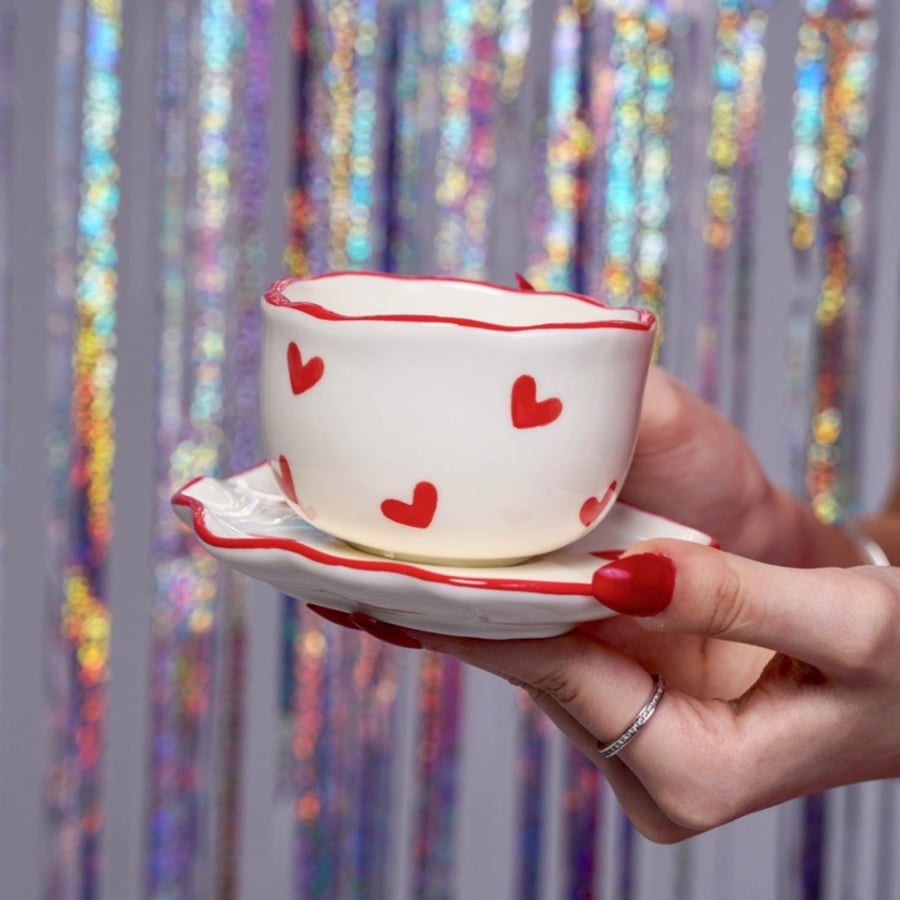 A cup with red heart print