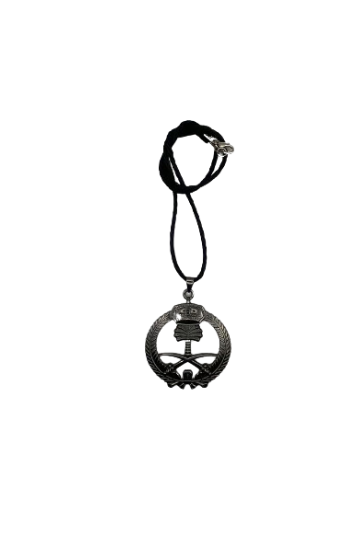 A black pendant of a sword and a palm tree