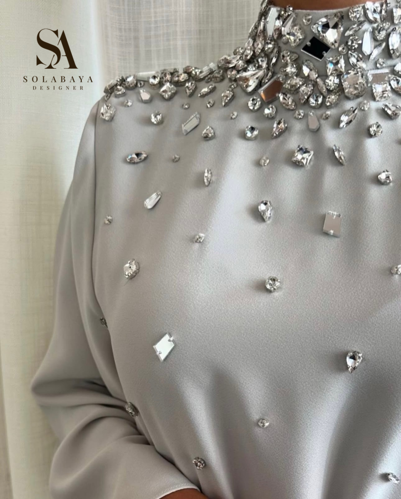 A traditional robe decorated with sparkling Swarovski crystals that add a unique shine to your look