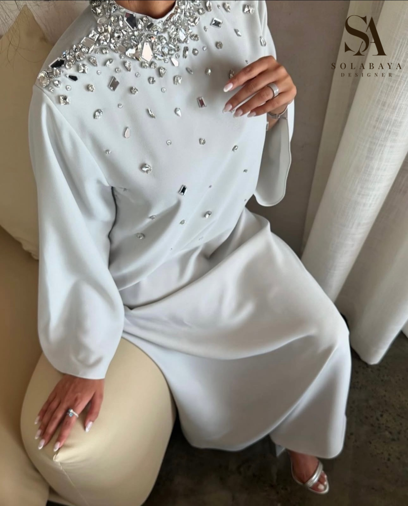 A traditional robe decorated with sparkling Swarovski crystals that add a unique shine to your look