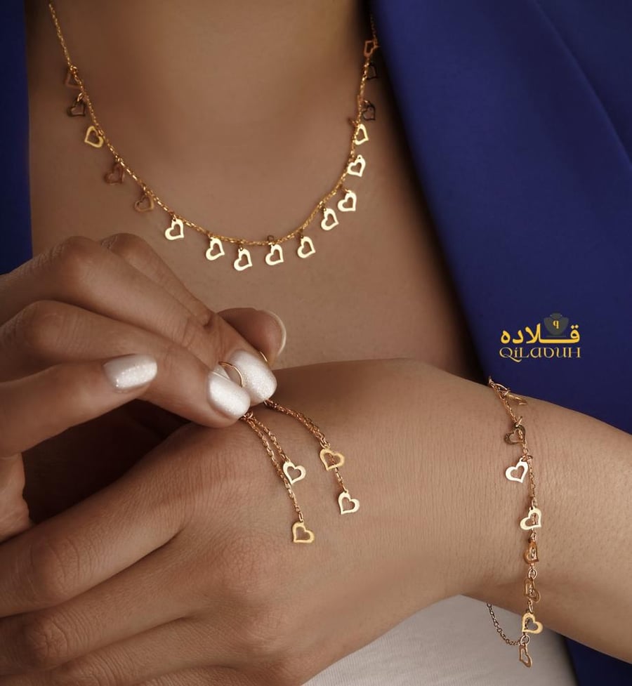 طقم نسائي-فخم مميزه مطليه ذهب عيار 21 تصميم راقي
