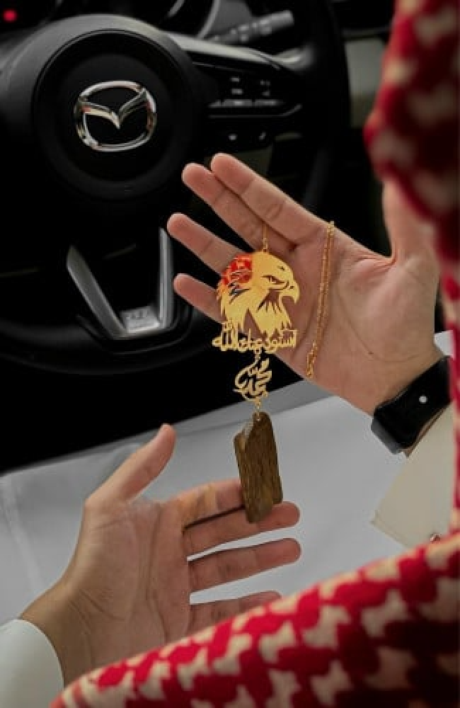 Car pendant in the shape of a hawk design made upon your request