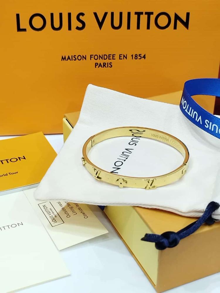Louis Vuitton brand bracelet gold with accessories