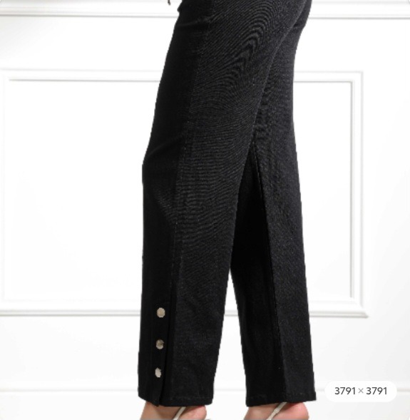 Mid-waisted jeans with an elasticated drawstring, wide leg to the ankle, and buttons.